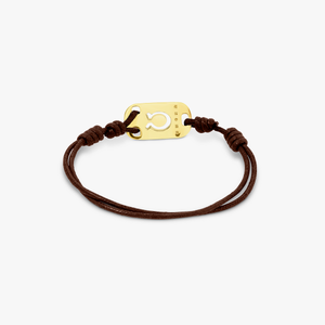 18K gold Taurus bracelet with brown cord