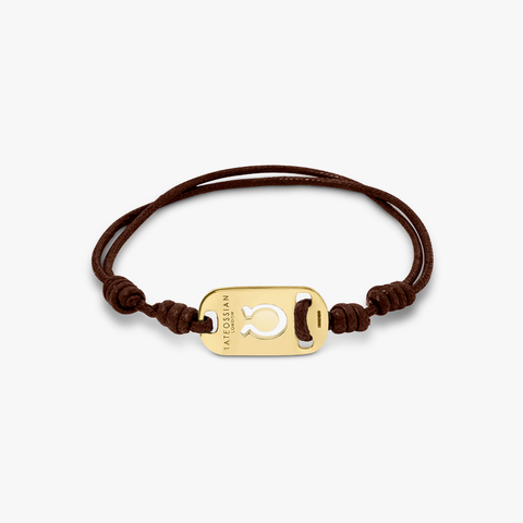 18K gold Taurus bracelet with brown cord